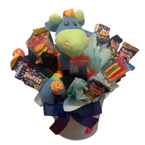 Blue Giraffe in a metal tin surrounded by chocolate and lollies