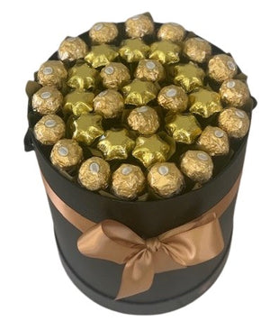 ferrero rocher and chocolate star edible gift bouquet in a black hat box